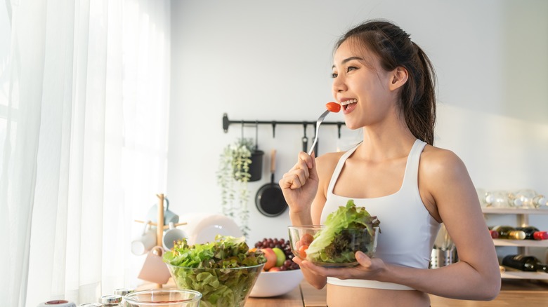 woman eating salad