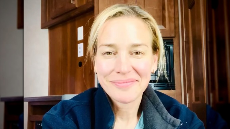 A clean-faced selfie of Piper Perabo wearing a Harris/Walz hat.