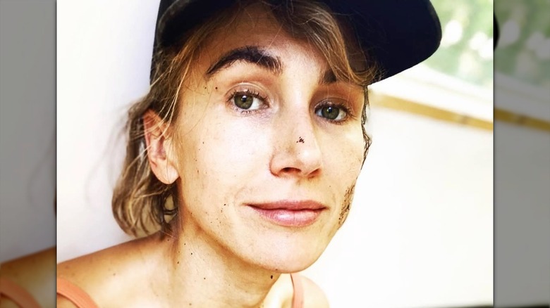 A makeup-free selfie of Jen Landon with dirt on her face.