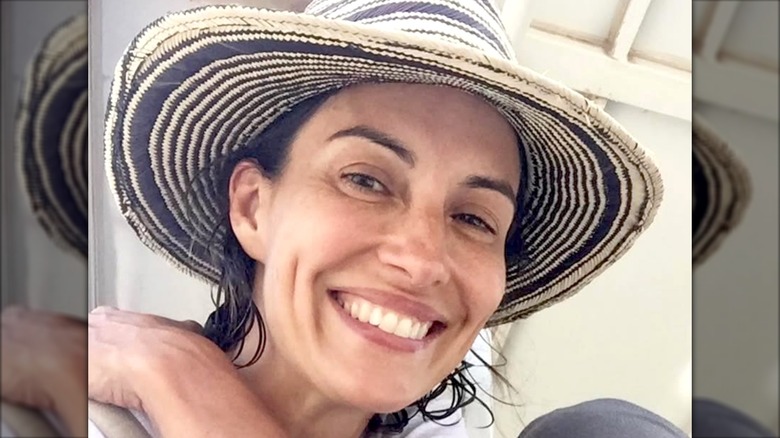 Wendy Moniz smiling without makeup on a trip to Thailand.