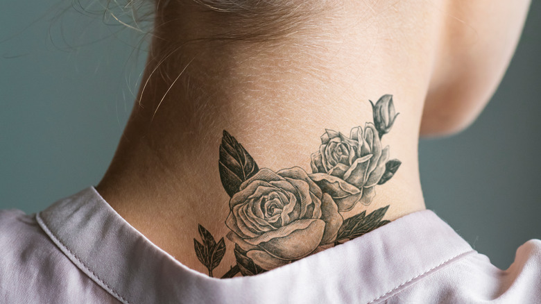 female back neck tattoo