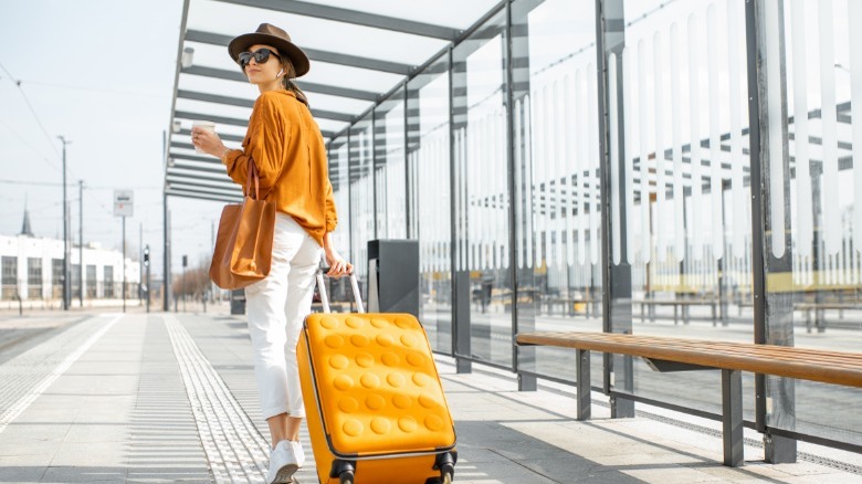 Woman with a yellow suitcase