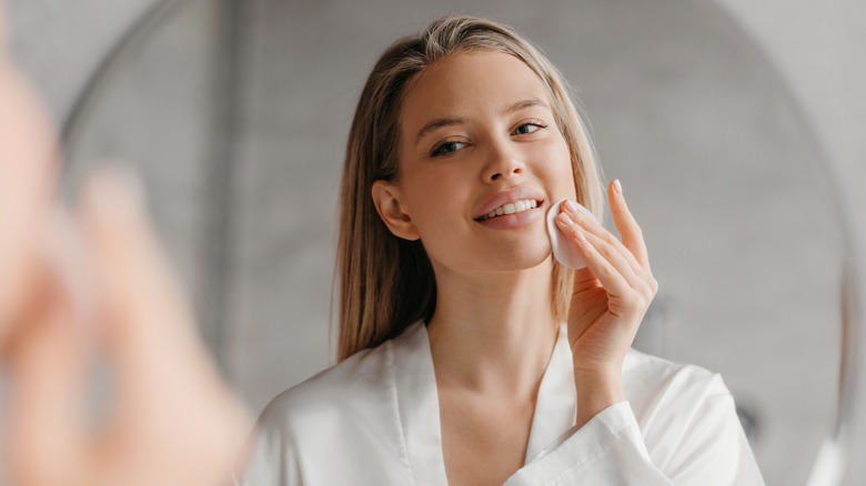 Woman looking in mirror