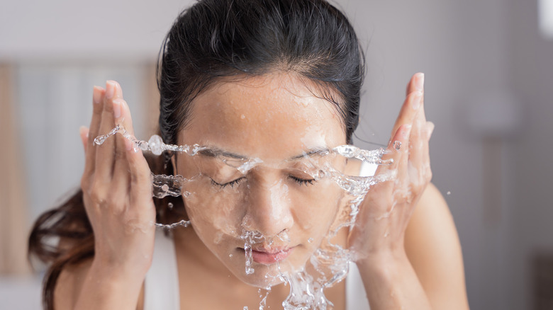 Woman washing face