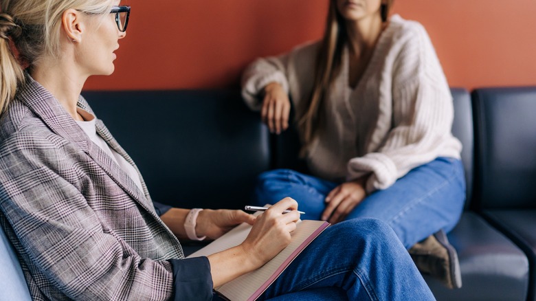 Woman speaks to therapist 