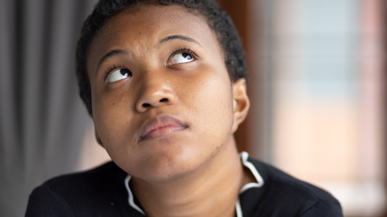 woman rolling her eyes