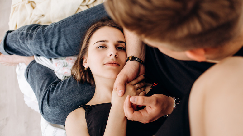 girl lying in boyfriend's lap