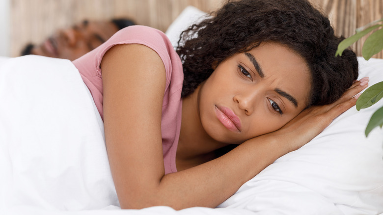 Woman frustrated bed