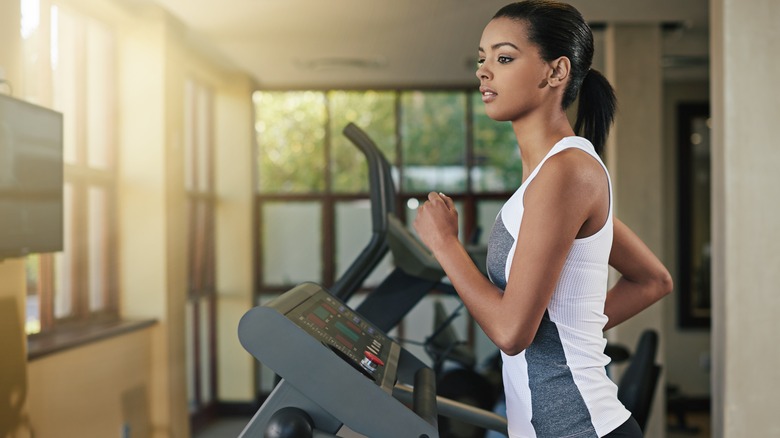 Woman exercising on treadmill