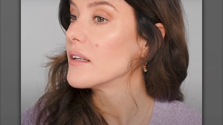 Lisa Eldridge poses after applying makeup