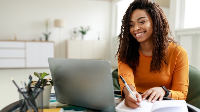 Woman studies laptop