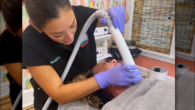 Aesthetician performs Sofwave procedure