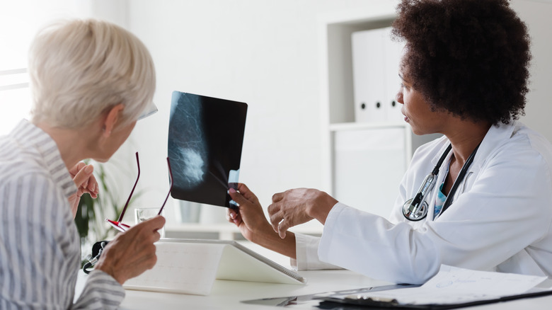 Woman discussing mammogram with doctor 