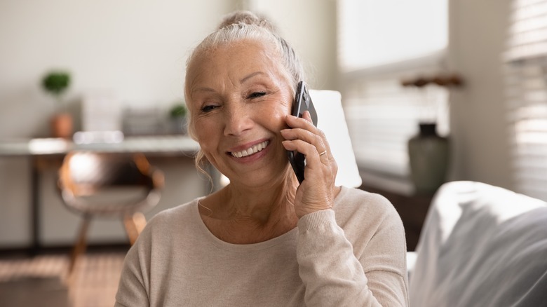 Elderly woman talking on phone