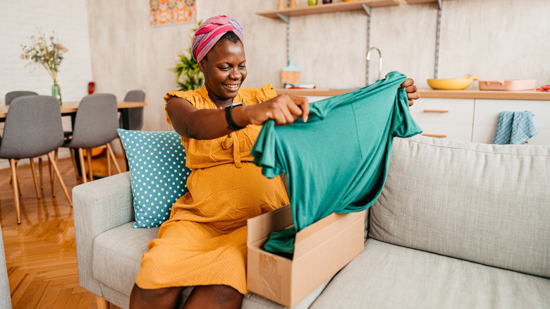 Woman unboxes online purchase