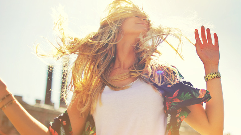 Sun shines on woman's hair 