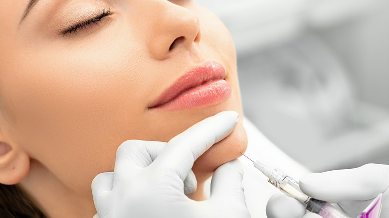 woman receiving injections on chin 