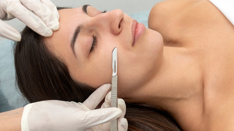 woman getting dermaplaning procedure