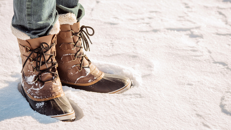 Wool-lined duck boots standing in snow
