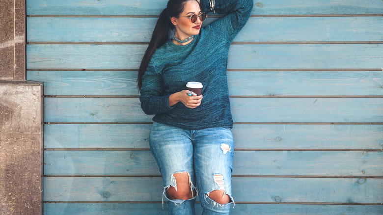 Woman wearing ripped jeans