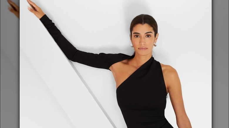 Marcella New York  model wears asymmetrical black dress