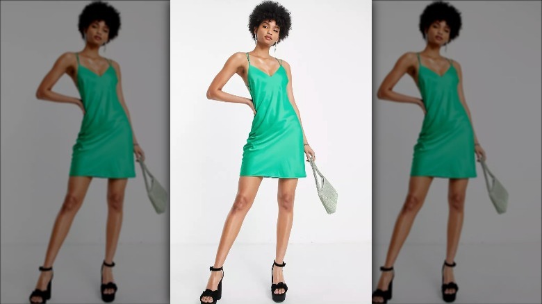 Asos model wears tall emerald mini 