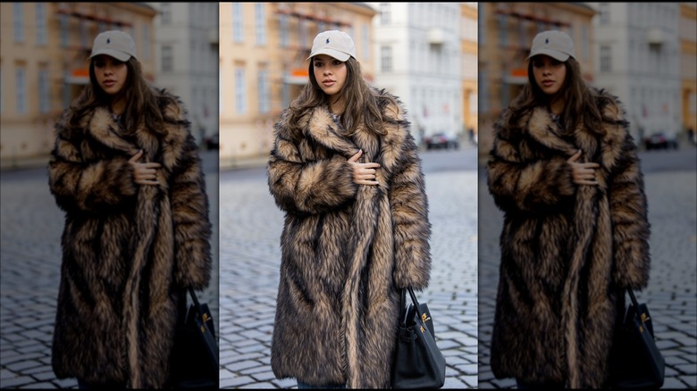 Woman wearing faux fur long coat