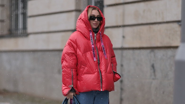 Woman wearing red puffer jacket