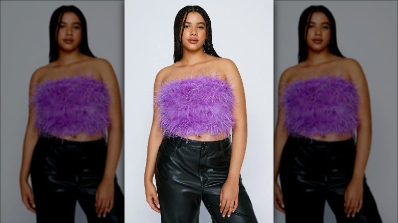 Nasty Gal model wears purple feather top and leather pants
