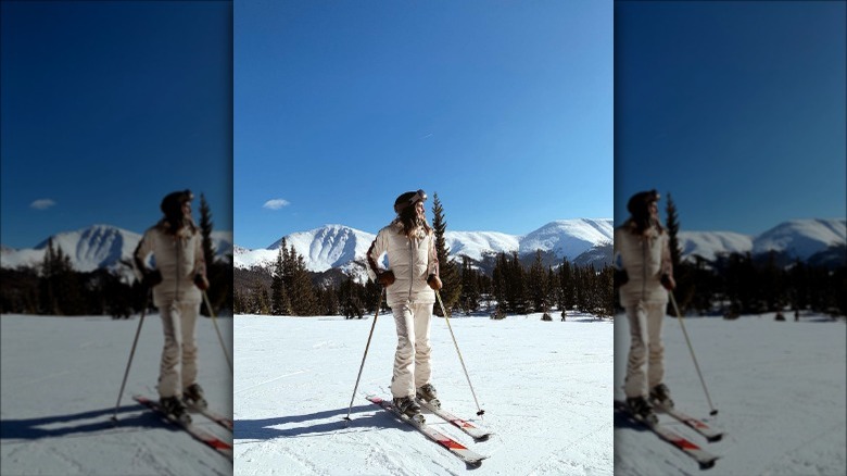 Individual in white skiing ensemble