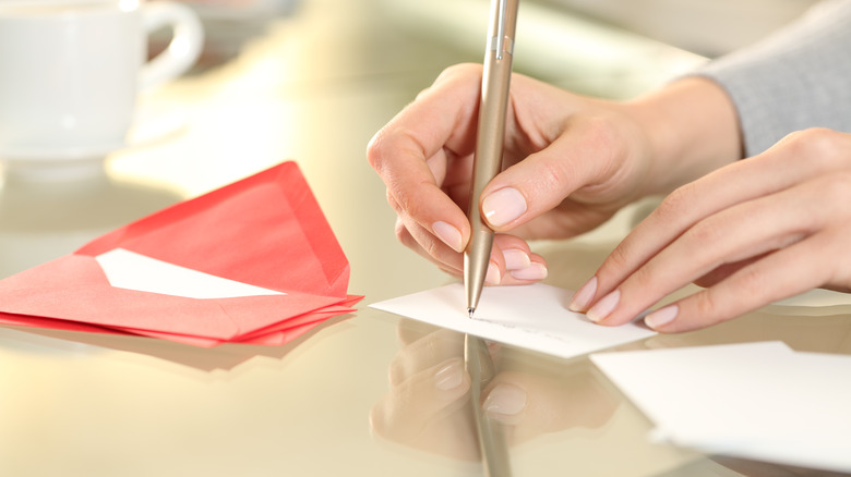 Woman writing in a card