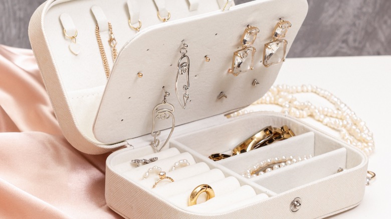 Box of different jewelry pieces
