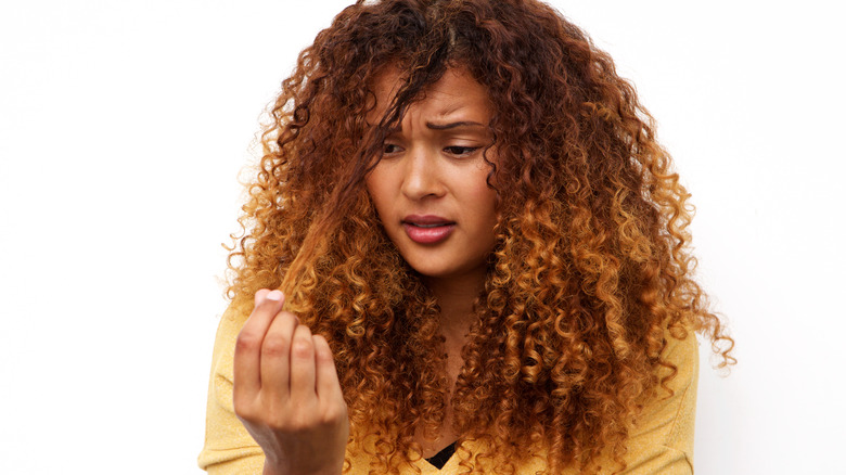 woman unhappy with curly hair