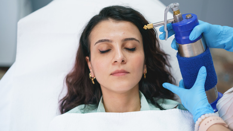 Girl undergoing cryotherapy