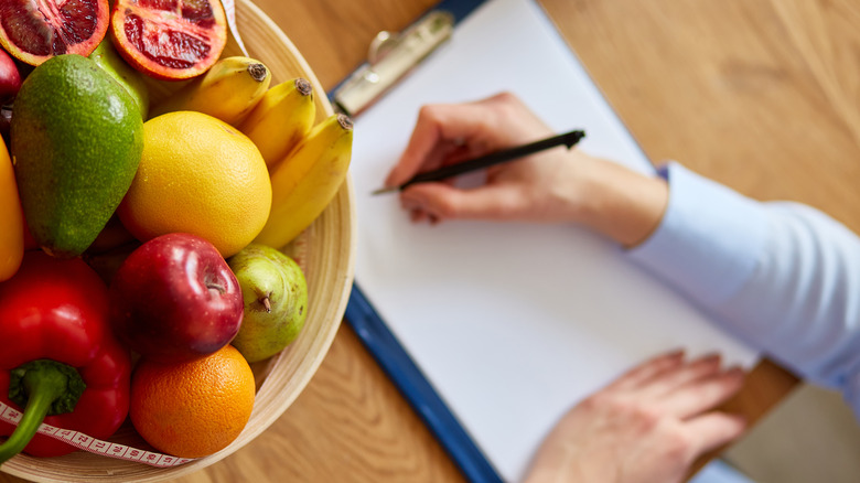 Woman writing down her diet