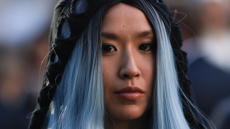 Person with light blue hair