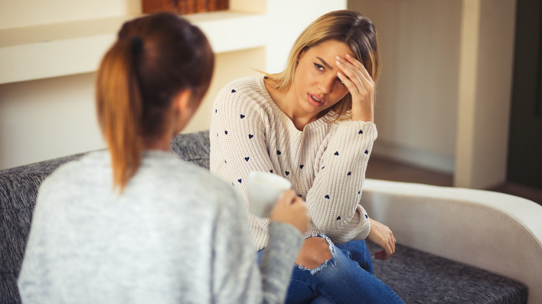 woman confiding in her friend