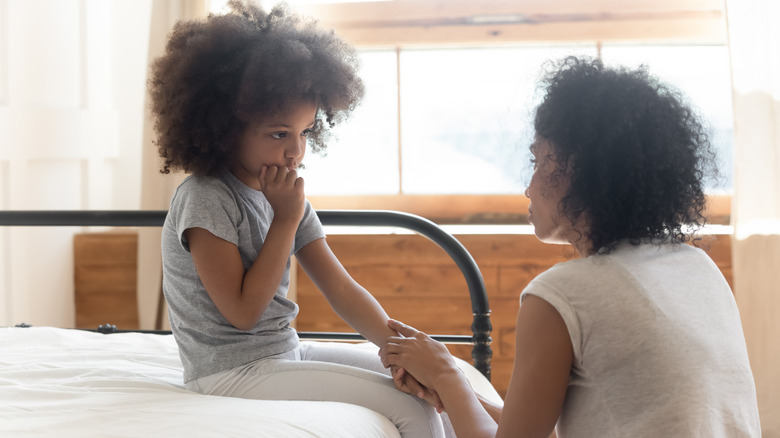 Woman comforting child