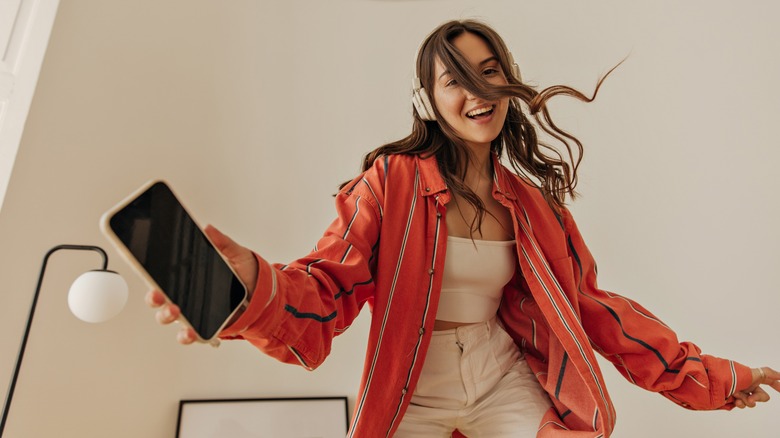 woman smiling and dancing