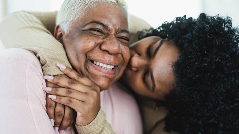 daughter and mother hugging