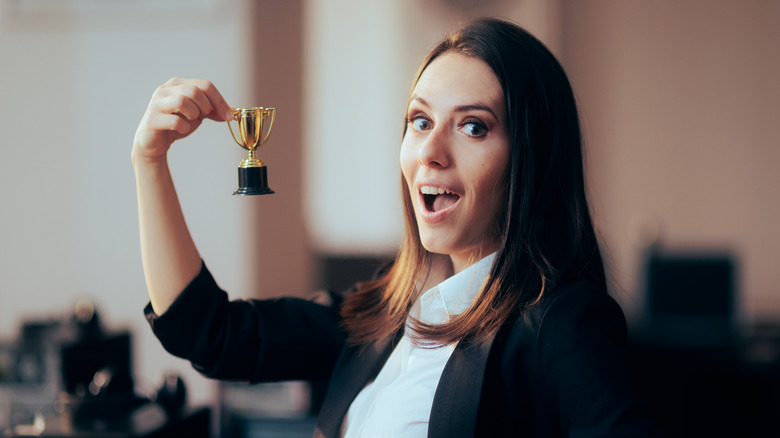 woman with a small trophy  