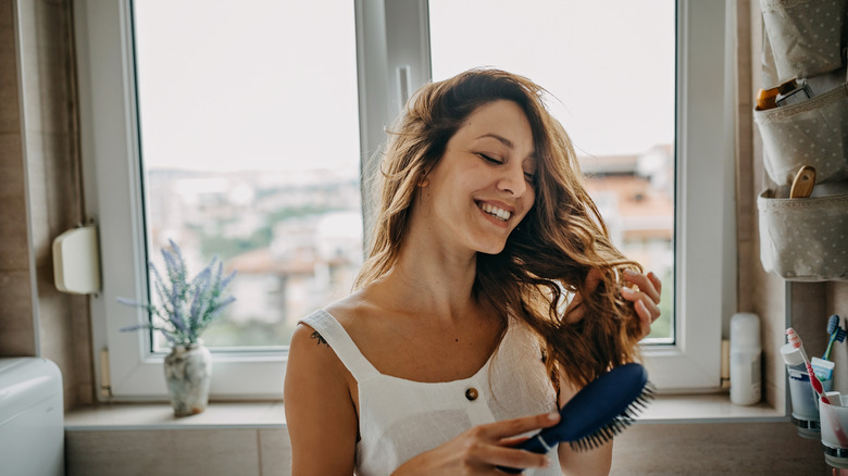 woman combing hair