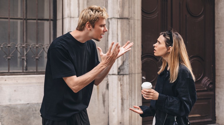 A man and woman arguing