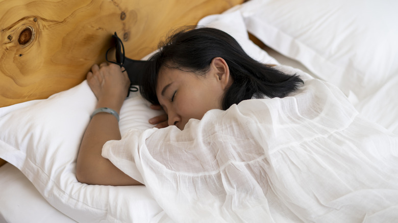 Woman sleeping in freefall position