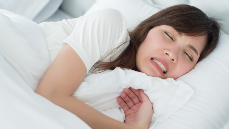 Woman grinding teeth in her sleep