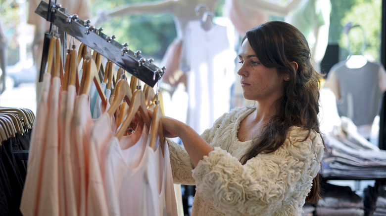 Woman looking through clothes