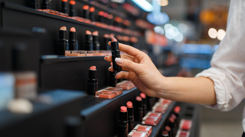 woman buying lipstick