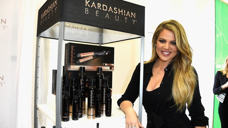 Khloe Kardashian with Kardashian Beauty hair care products