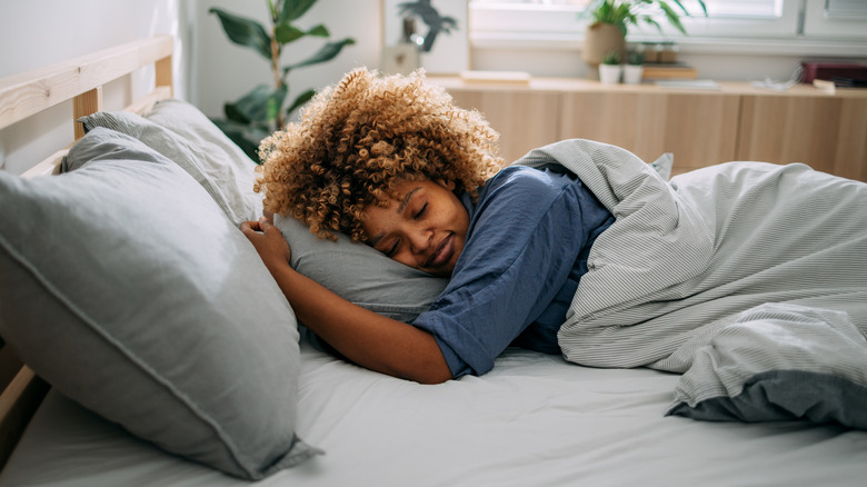 person sleeping in bed