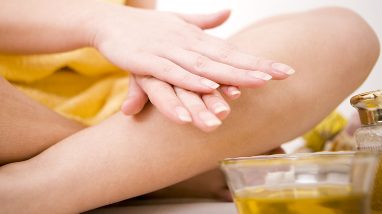 Woman doing hot oil manicure